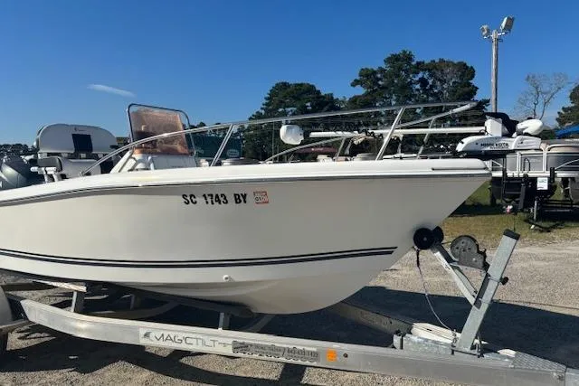 Slide: The Image of 2008 Clearwater 180 center console boat on trailer, parked outdoors. - 3