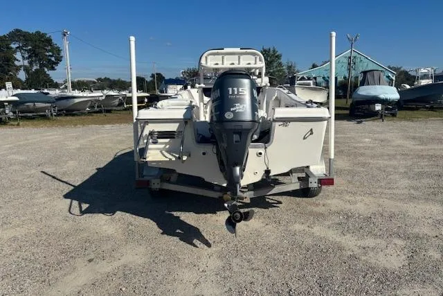 Slide: The Image of 2008 Clearwater 180 center console boat with 115 HP engine, parked on gravel lot. - 9