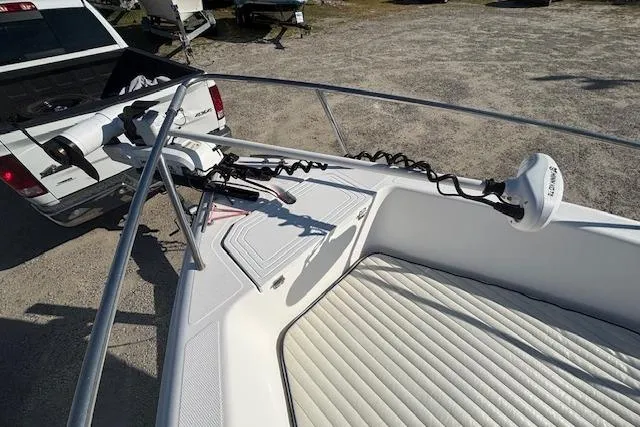 Slide: The Image of 2008 Clearwater 180 center console boat with trolling motor, parked on a trailer. - 11