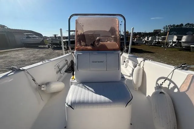 Slide: The Image of 2008 Clearwater 180 center console boat with seating and fenders, parked outdoors. - 12