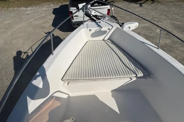 Slide: The Image of 2008 Clearwater 180 Center Console boat with cushioned bow, parked on a trailer. - 13