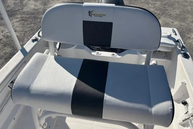 Slide: The Image of 2008 Clearwater 180 Center Console boat seat with black and white upholstery. - 16