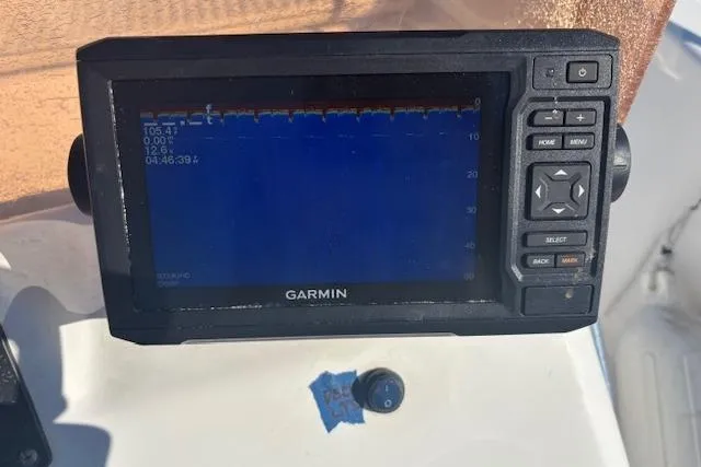 Slide: The Image of Garmin marine GPS on 2008 Clearwater 180 center console boat dashboard. - 17
