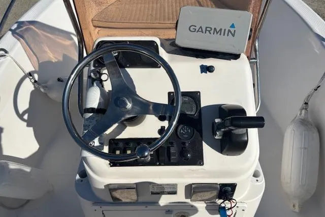 Slide: The Image of 2008 Clearwater 180 center console with Garmin navigation system and steering wheel. - 18