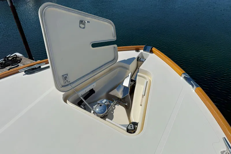Slide: The Image of Open anchor hatch on 2003 Hinckley Talaria 40 yacht, showcasing marine equipment. - 19