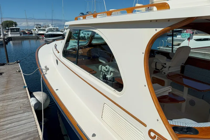 Slide: The Image of 2003 Hinckley Talaria 40 yacht docked at marina, showcasing elegant design and craftsmanship. - 6