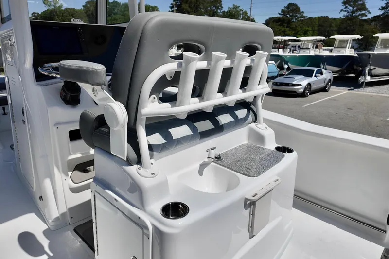 Slide: The Image of 2026 NauticStar 251 Hybrid boat interior with rod holders and sink station. - 14