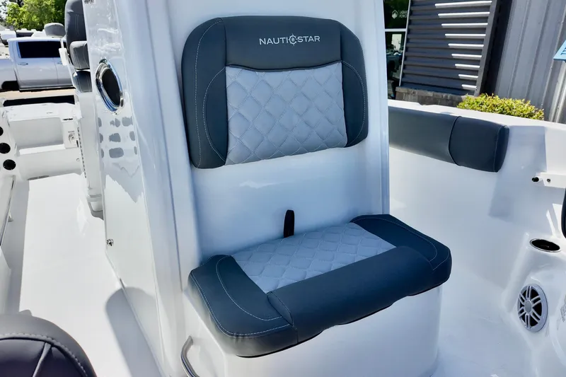 Slide: The Image of 2026 NauticStar 251 Hybrid boat seat with quilted design and logo. - 18