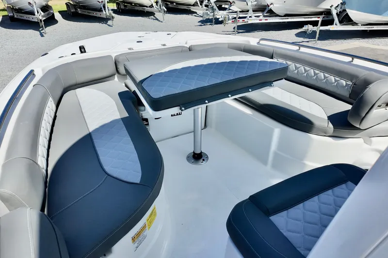 Slide: The Image of 2026 NauticStar 251 Hybrid boat interior with cushioned seating and table. - 20