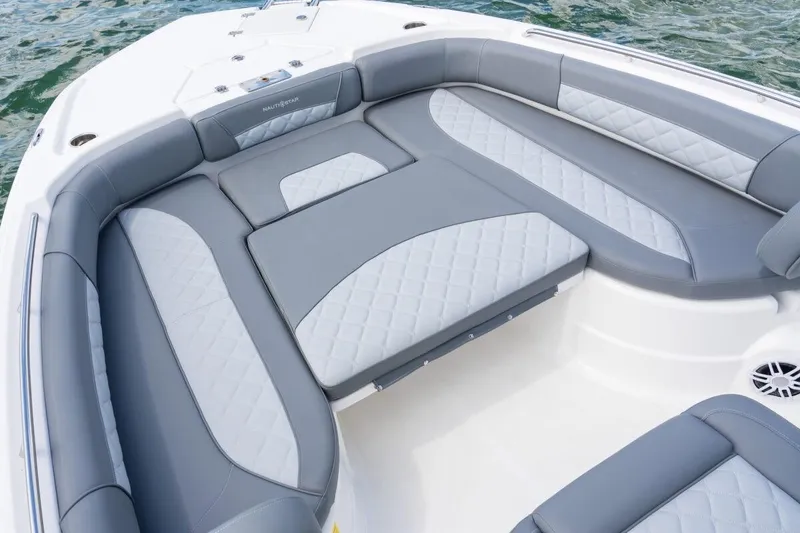 Slide: The Image of Luxurious seating on 2026 NauticStar 251 Hybrid boat, featuring elegant gray and white upholstery. - 8