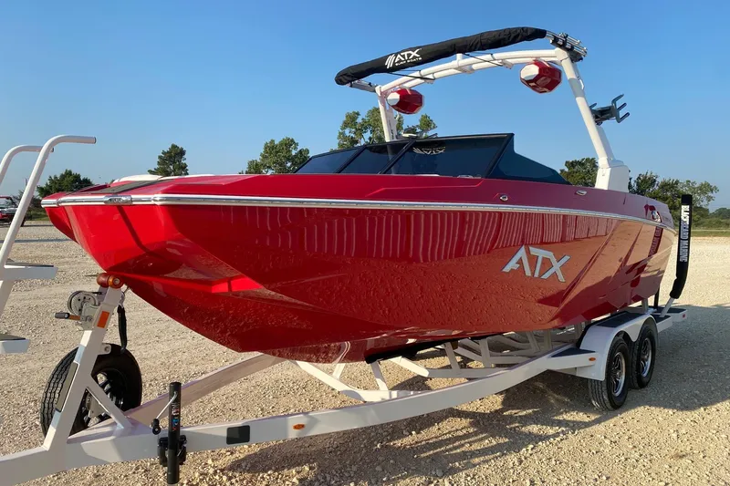 Slide: The Image of 2026 ATX Surf Boats 22 Type-S, red, on trailer, parked outdoors. - 2