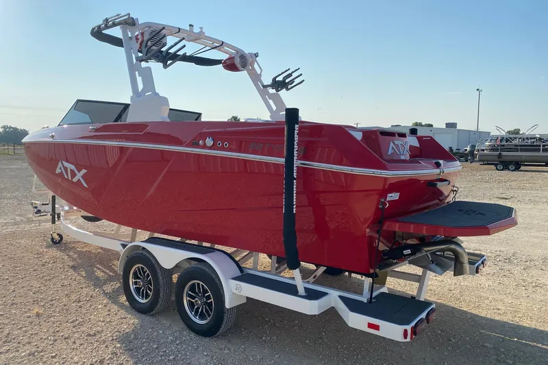 Slide: The Image of 2026 ATX Surf Boats 22 Type-S, red, on trailer, outdoor setting. - 3