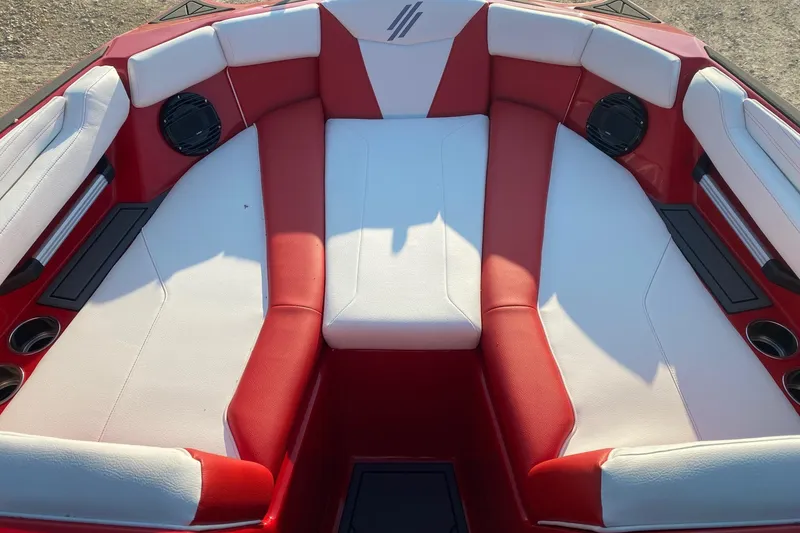 Slide: The Image of 2026 ATX Surf Boats 22 Type-S interior with red and white seating and speakers. - 8