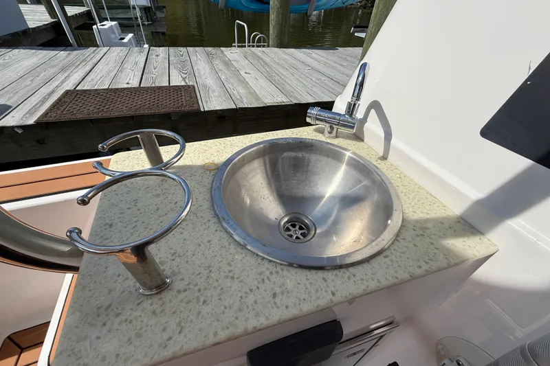 Slide: The Image of Stainless steel sink on 2021 Ranger Tugs R-41CB boat, dockside view. - 11