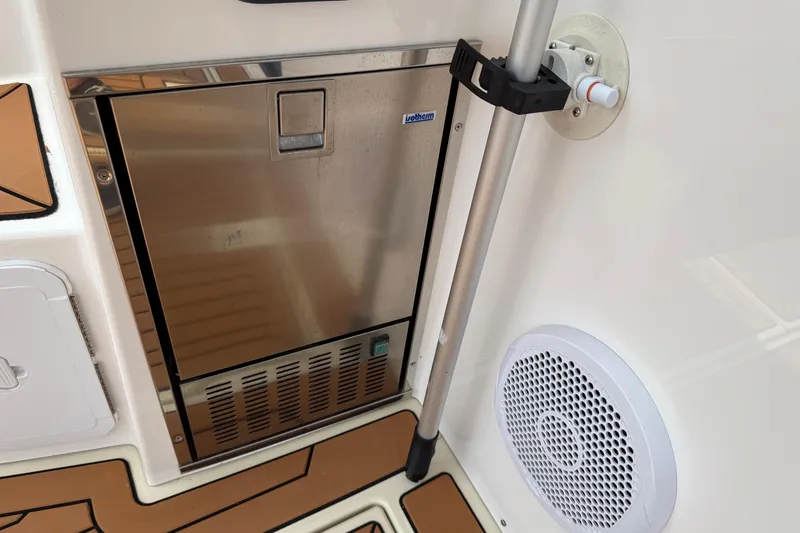 Slide: The Image of 2021 Ranger Tugs R-41CB boat interior with stainless steel appliance and speaker. - 12