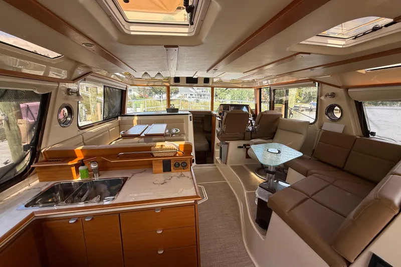 Slide: The Image of Luxurious interior of 2021 Ranger Tugs R-41CB with modern kitchen and seating area. - 16