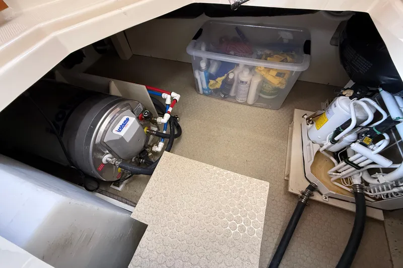 Slide: The Image of Engine room of 2021 Ranger Tugs R-41CB with equipment and storage box. - 23