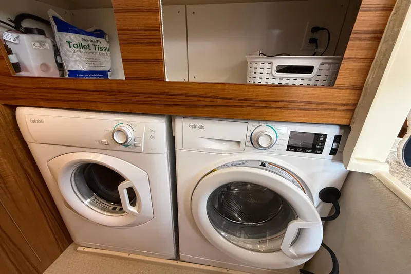 Slide: The Image of Laundry area in 2021 Ranger Tugs R-41CB with Splendide washer and dryer. - 27