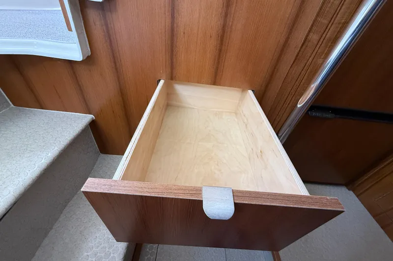 Slide: The Image of Empty wooden drawer in 2021 Ranger Tugs R-41CB boat interior. - 30