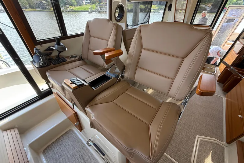 Slide: The Image of Luxurious interior seating of 2021 Ranger Tugs R-41CB boat with leather upholstery. - 31