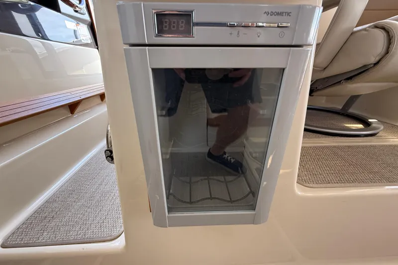Slide: The Image of Dometic fridge inside 2021 Ranger Tugs R-41CB boat, featuring digital temperature display. - 34