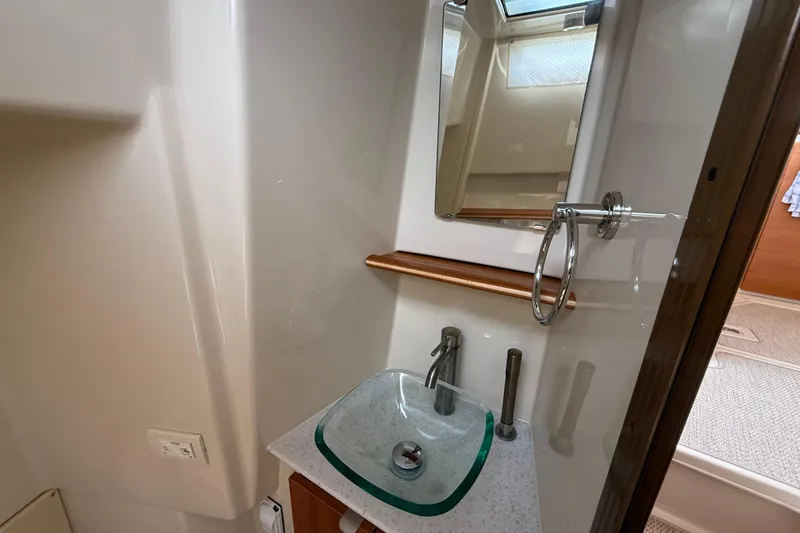 Slide: The Image of 2021 Ranger Tugs R-41CB bathroom with modern sink and mirror. - 36