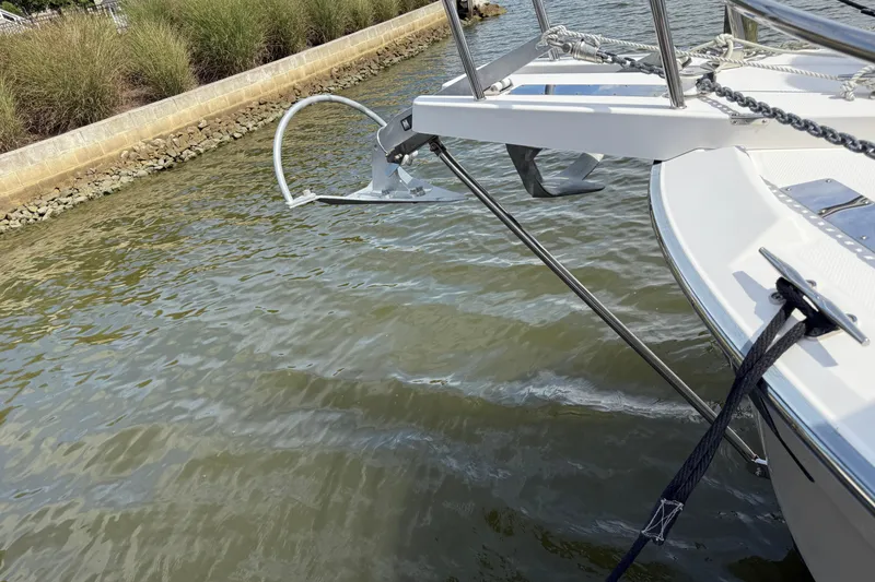Slide: The Image of 2021 Ranger Tugs R-41CB boat anchor and bow detail on calm water. - 48