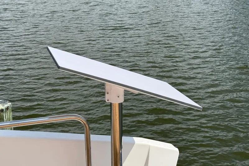 Slide: The Image of Satellite dish on 2021 Ranger Tugs R-41CB boat, overlooking water. - 51