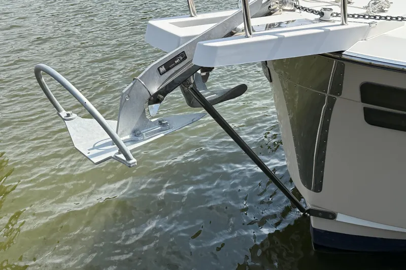 Slide: The Image of 2021 Ranger Tugs R-41CB boat anchor detail on calm water. - 53