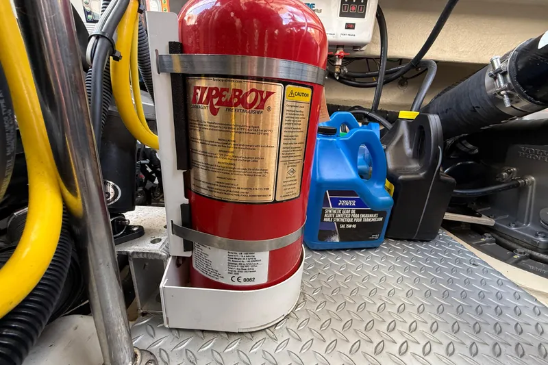 Slide: The Image of Fire extinguisher and engine supplies in 2021 Ranger Tugs R-41CB engine room. - 59