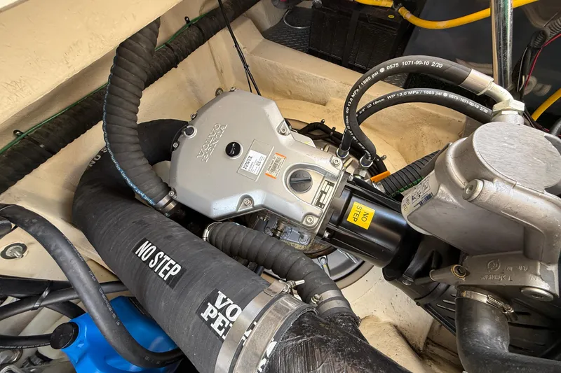 Slide: The Image of Engine compartment of 2021 Ranger Tugs R-41CB with visible hoses and components. - 60