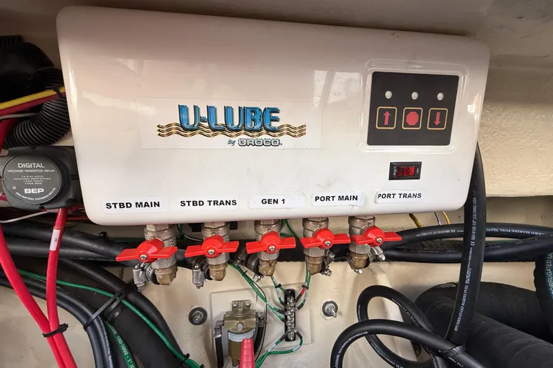 Slide: The Image of Control panel of a 2021 Ranger Tugs R-41CB with labeled valves and wiring. - 63
