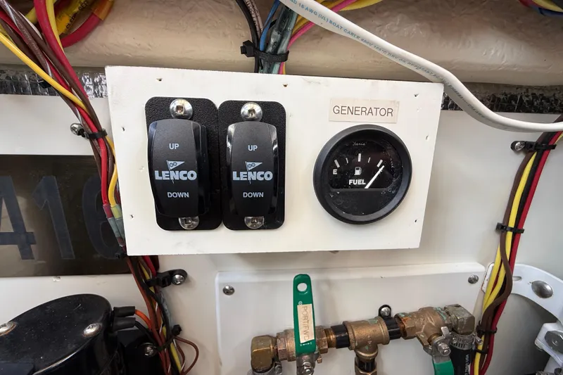 Slide: The Image of Control panel of a 2021 Ranger Tugs R-41CB with Lenco switches and fuel gauge. - 64