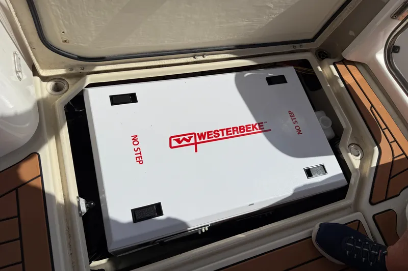 Slide: The Image of Westerbeke generator in 2021 Ranger Tugs R-41CB boat compartment, labeled "No Step." - 66