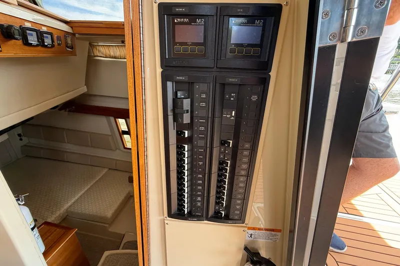 Slide: The Image of 2021 Ranger Tugs R-41CB interior showing control panel and cabin area. - 67