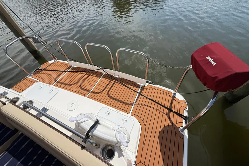 Slide: The Image of 2021 Ranger Tugs R-41CB boat deck with teak flooring and Magma grill cover. - 8