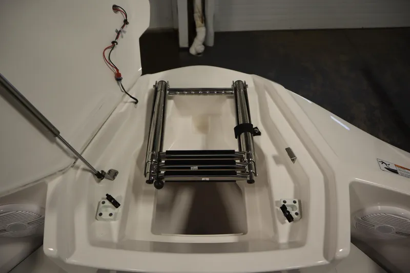 Slide: The Image of 2026 Yamaha Boats AR220 bow with ladder and storage compartment. - 12