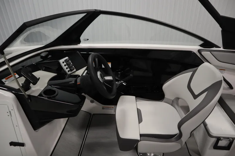 Slide: The Image of 2026 Yamaha Boats AR220 cockpit with modern steering and seating design. - 20