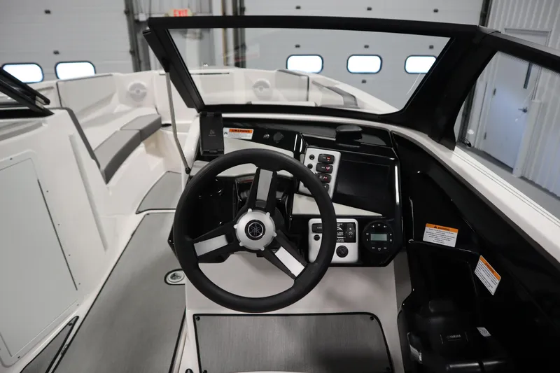 Slide: The Image of 2026 Yamaha Boats AR220 cockpit with modern steering and control panel. - 21