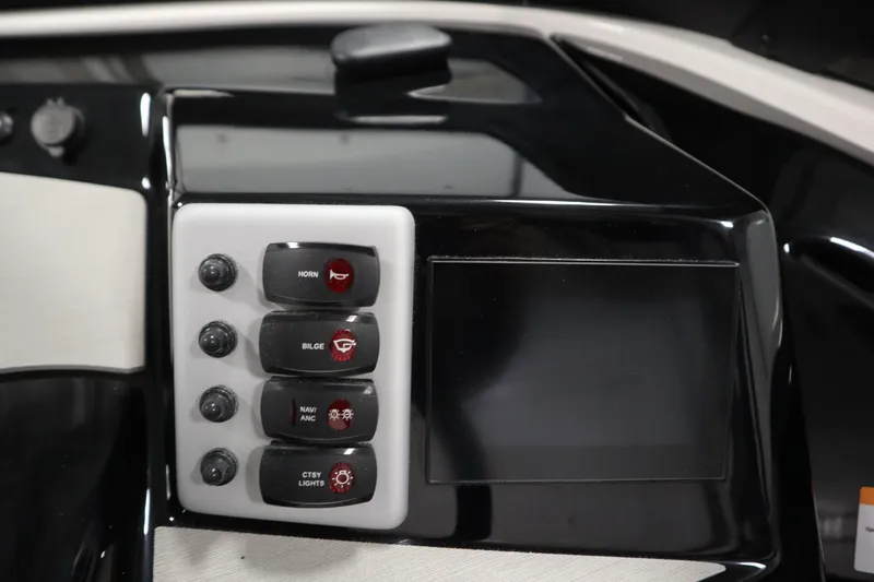Slide: The Image of Control panel of 2026 Yamaha Boats AR220 with switches and display screen. - 24