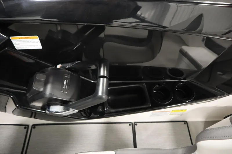 Slide: The Image of 2026 Yamaha Boats AR220 cockpit with throttle control and cup holders. - 26
