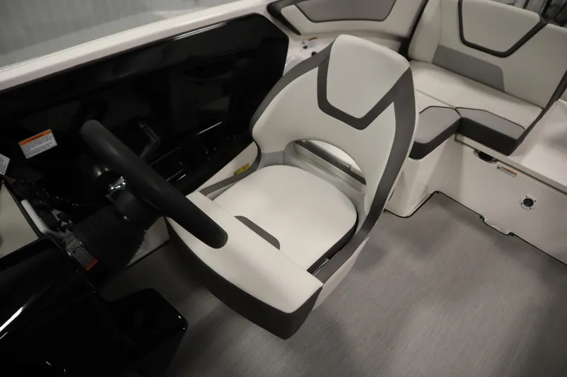 Slide: The Image of 2026 Yamaha Boats AR220 interior with modern seating and steering wheel. - 27