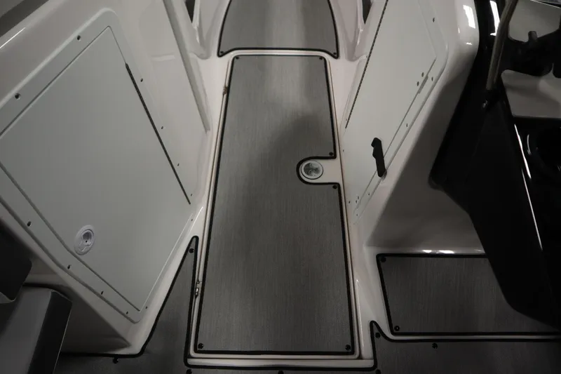 Slide: The Image of 2026 Yamaha Boats AR220 interior flooring and storage compartments. - 29