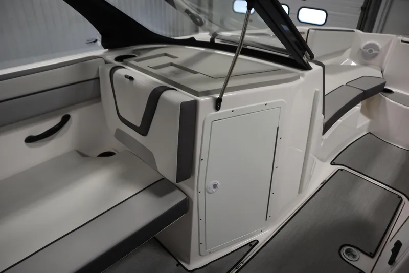 Slide: The Image of 2026 Yamaha Boats AR220 interior seating and storage area, featuring sleek design and modern finishes. - 31
