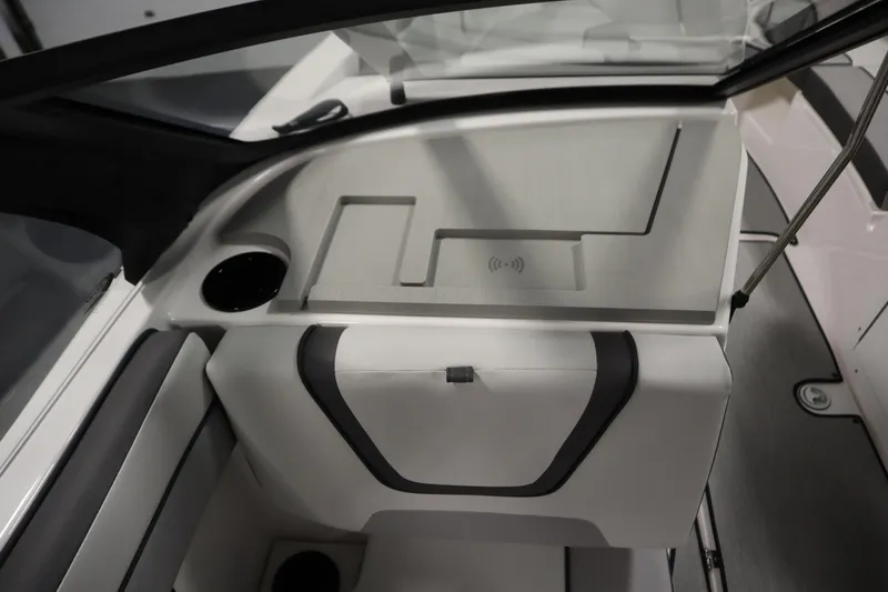 Slide: The Image of 2026 Yamaha Boats AR220 interior with sleek design and integrated cup holder. - 32