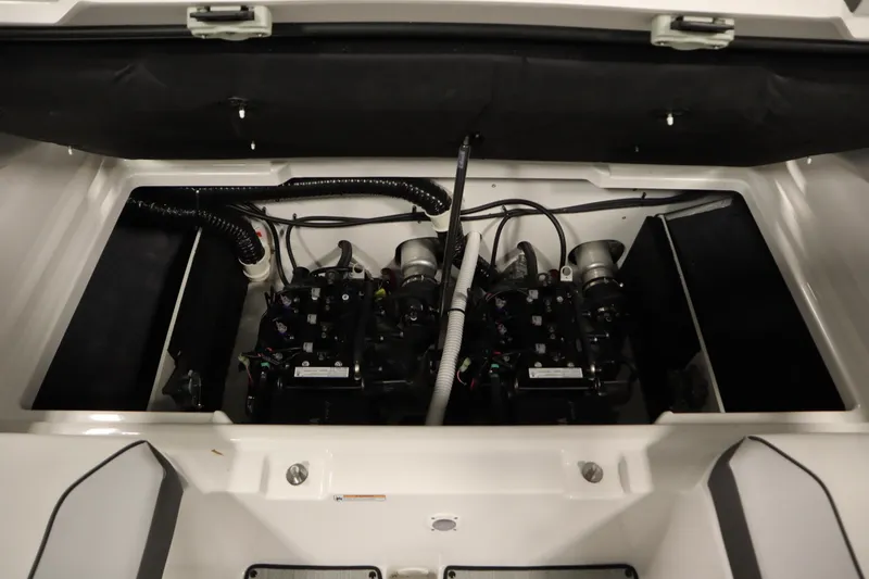 Slide: The Image of 2026 Yamaha Boats AR220 engine compartment with dual engines and wiring. - 35