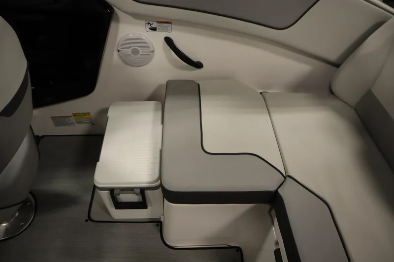 Slide: The Image of 2026 Yamaha Boats AR220 interior seating with integrated storage and speaker. - 36