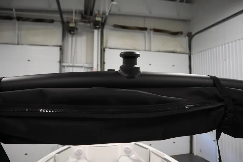 Slide: The Image of 2026 Yamaha Boats AR220 interior detail with black canopy and support structure. - 39