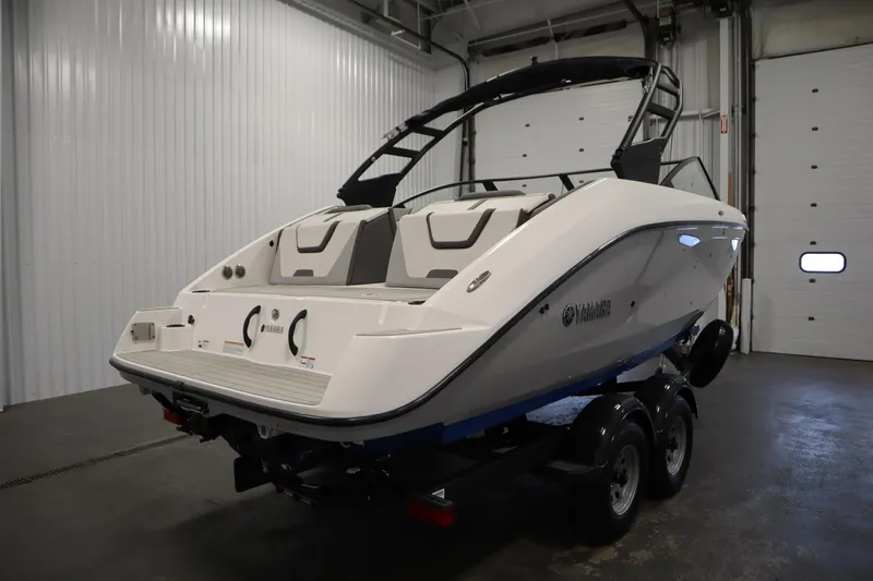 Slide: The Image of 2026 Yamaha Boats AR220 in a showroom, showcasing sleek design and modern features. - 4