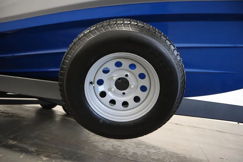 Slide: The Image of 2026 Yamaha Boats AR220 trailer wheel and blue hull detail. - 43